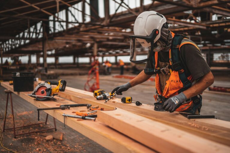 Worker working on a job site in protective gear.